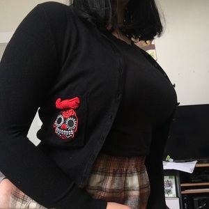 Too Fast black cropped cardigan with red skulls